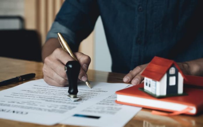 What is Asset Based Lending in Real Estate? Client reading over Asset Based Lending documents.