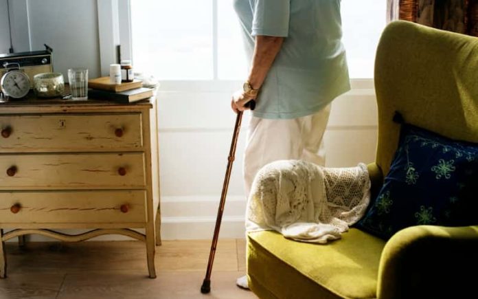 Rights of the Elderly - Hammerle Finley Law Firm Elderly woman standing in her living room. Hammerle Finley Law Firm located in Lewisville, Texas