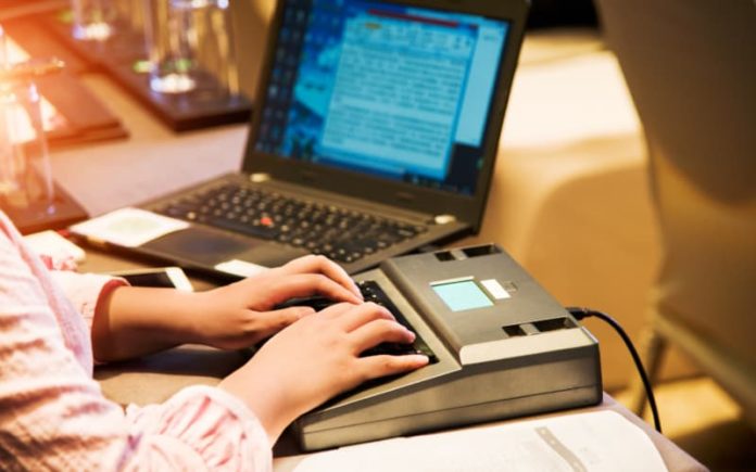 What Happens During A Deposition typing on a computer
