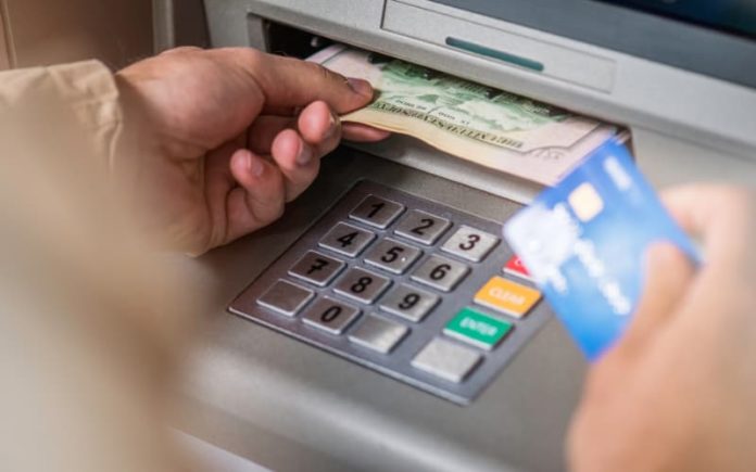 Customer taking cash from ATM Customer taking cash from ATM