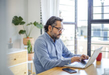 Job Hop and Corporate Transparency man using laptop at home